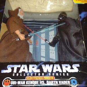 Vintage OBI-Wan Kenobi VS Darth Vader 1997. Star Wars Collectors Series. In Original Box. Good Condition. Made In China.