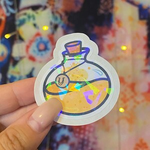 Lucky Potion Vinyl Sticker: Add a touch of magic to your belongings with this enchanting and whimsical adhesive accessory.