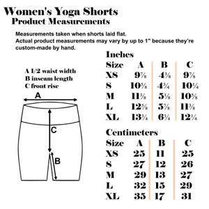 May include: A chart showing measurements for yoga shorts in inches and centimeters. The chart includes measurements for waist width, inseam length, and front rise. The sizes listed are XS, S, M, L, and XL.