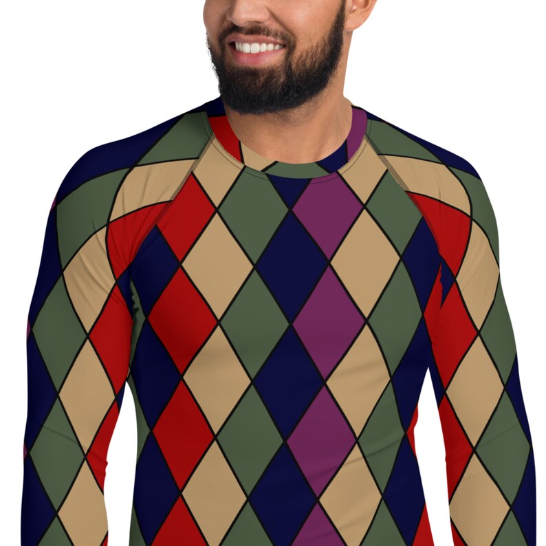 May include: A long-sleeved shirt with a diamond pattern in shades of red, blue, green, and purple.