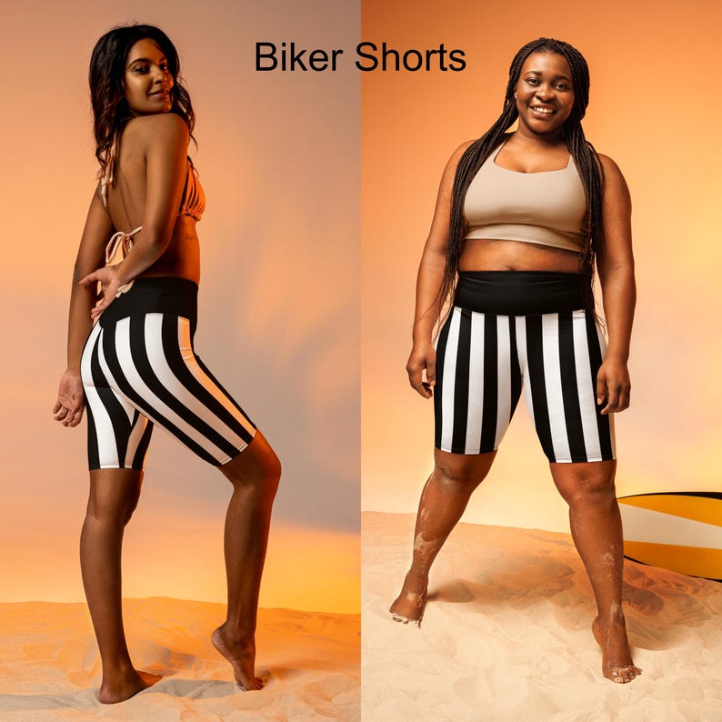 May include: Two people wearing black and white striped biker shorts. The shorts have a high waist and are made of a stretchy fabric. The text "Biker Shorts" is displayed at the top of the image.
