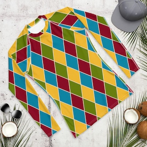 May include: A long-sleeved shirt with a diamond pattern in shades of yellow, red, blue, and green.
