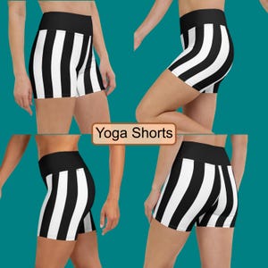 May include: Black and white striped yoga shorts with a high waist. The shorts are made of a stretchy, comfortable fabric and are perfect for working out or lounging around the house.