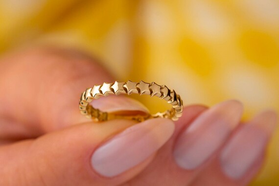 Gold star on sale band ring