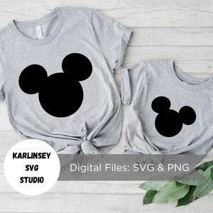 May include: Two gray t-shirts with a black Mickey Mouse silhouette design. The larger shirt has the silhouette centered on the front, while the smaller shirt has the silhouette on the right side. The text "Digital Files: SVG & PNG" is printed on a white background below the shirts.