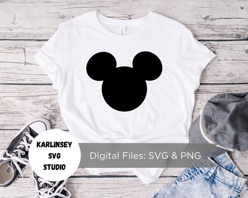 May include: White t-shirt with a black silhouette of Mickey Mouse's head. The text "Digital Files: SVG & PNG" is printed on the bottom of the shirt.