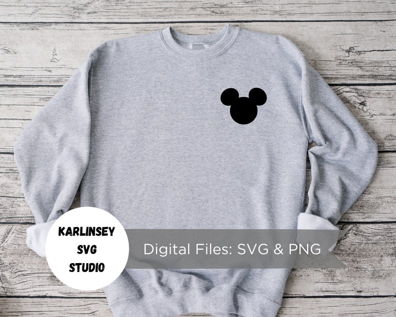 May include: Gray sweatshirt with a black Mickey Mouse silhouette on the front. The text "KARLINSEY SVG STUDIO" is on a white circle on the bottom left of the sweatshirt. The text "Digital Files: SVG & PNG" is on the bottom right of the sweatshirt.