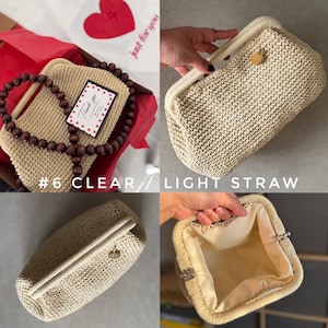 May include: A light straw-colored clutch with a woven texture. The bag has a rounded rectangular shape with a cream-colored frame and a wooden clasp. The interior is lined with a light-colored fabric. The text "#6 CLEAR / LIGHT STRAW" is visible.