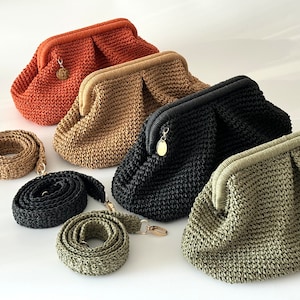 May include: Four crocheted handbags in different colors: orange, beige, black, and green. Each bag has a gold clasp and comes with a matching crocheted strap.