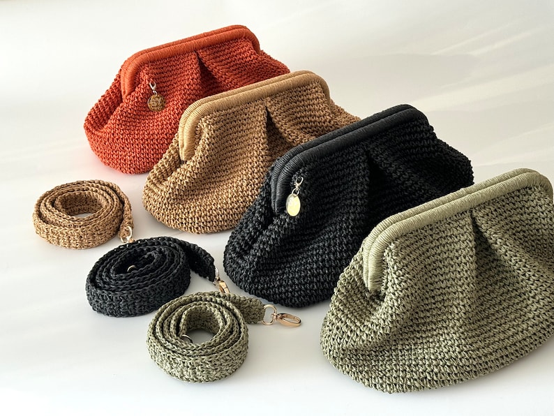 May include: Four crocheted handbags in different colors: orange, beige, black, and green. Each bag has a gold clasp and comes with a matching crocheted strap.