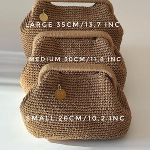 May include: Three woven handbags in varying sizes, stacked. The largest bag is labeled "LARGE 35CM/13.7 INC", the medium bag is labeled "MEDIUM 30CM/11.8 INC", and the smallest bag is labeled "SMALL 26CM/10.2 INC". Each bag has a wooden handle.