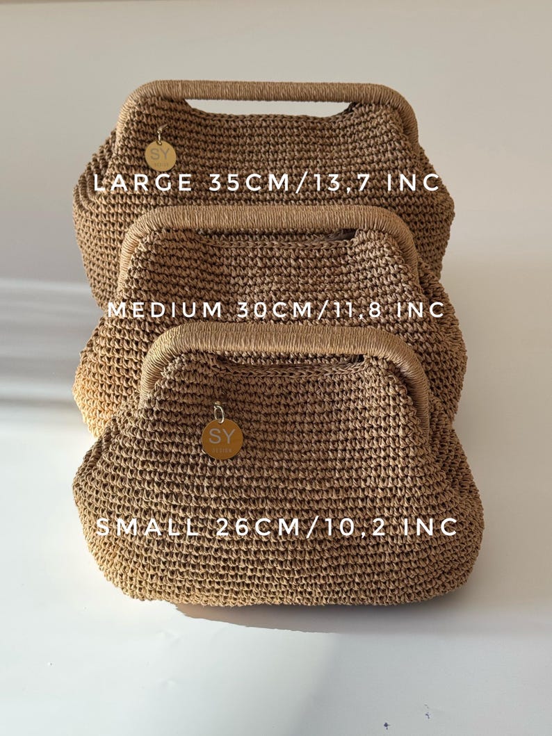 May include: Three woven handbags in varying sizes, stacked. The largest bag is labeled "LARGE 35CM/13.7 INC", the medium bag is labeled "MEDIUM 30CM/11.8 INC", and the smallest bag is labeled "SMALL 26CM/10.2 INC". Each bag has a wooden handle.