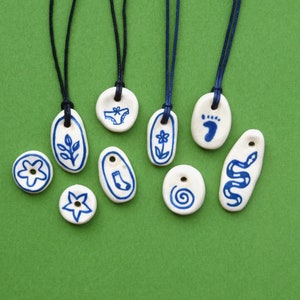 Handmade ceramic pendants on adjustable cord