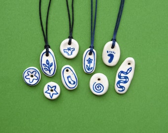 Handmade ceramic pendants on adjustable cord