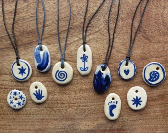 Handmade ceramic pendants on adjustable cord