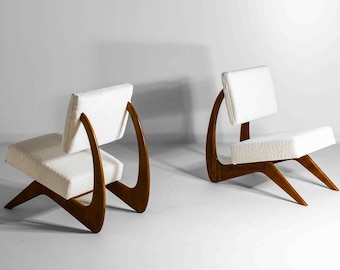 Pair of sculptural modernist lounge chairs in walnut & bouclé