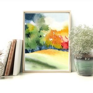May include: Watercolor painting of a landscape with trees in shades of green, yellow, orange, and red. The trees are in the background with a grassy field in the foreground.