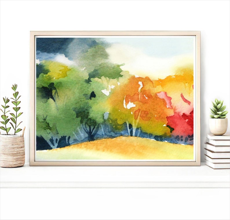 May include: Watercolor painting of a forest scene with trees in shades of green, yellow, orange, and red. The trees are painted in a loose, impressionistic style, and the background is a soft blue.