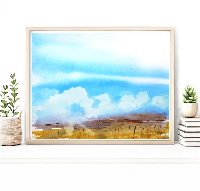 May include: Watercolor painting of a landscape with a field of tall grass in the foreground, a blue sky with white clouds, and sunbeams shining through the clouds.