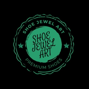 May include: A circular logo with the text "SHOE JEWEL ART" in a green, distressed font. The logo is set against a black background and includes the words "PREMIUM SHOES". Two small stars flank the central text.