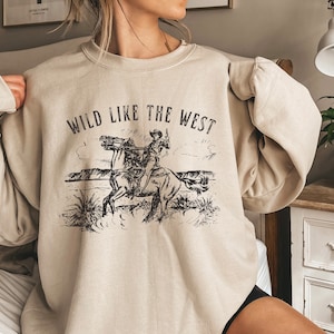 Wild Like the West sweatshirt | Western graphic | Cowgirl sweatshirt | Rodeo shirt | Retro cowboy sweatshirt | Cowgirl gift | Rodeo gift