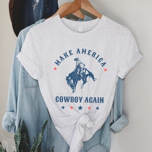 Make America Cowboy Again shirt | Western graphic tee | Patriotic rodeo shirt | Rodeo gift | American western tee | Cowgirl shirt