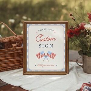 Framed 8x10 editable party sign displayed on vintage gingham picnic blanket with Americana inspired summer event styling