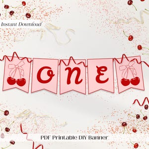 Peut inclure: Bannière imprimable rose et rouge avec le mot "ONE" en lettres rouges et des cerises à chaque extrémité. La bannière indique "PDF Printable DIY Banner" en bas.
