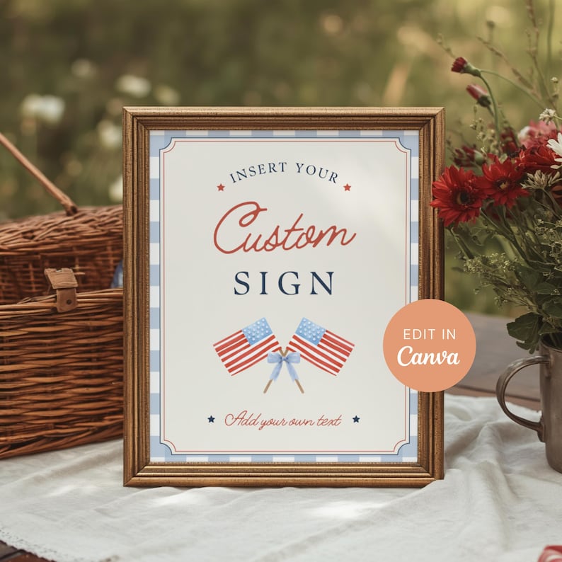 Printed 8x10 custom party sign displayed in vintage gold frame at a patriotic Fourth of July picnic celebration with Americana event decor