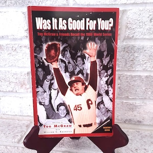May include: A red hardcover book titled "Was It As Good For You?" with a photo of a baseball player raising his arms in the air. The book is a collector's edition and is written by Tug McGraw with William C. Kashatus.