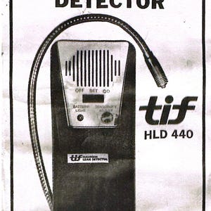 May include: Black and white image of a TIF HLD 440 halogen leak detector. The device has a flexible probe and a control panel with settings for off, set, and go. The text "HALOGEN LEAK DETECTOR" is at the top.