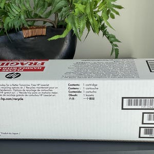 May include: White HP LaserJet printer cartridge box with red "FRAGILE" text. The box includes recycling information and the text "Contents: 1 cartridge". The box also has several barcodes and the product code CF440-00901.