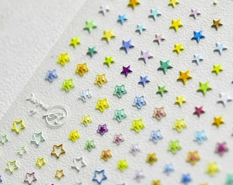 May include: A sheet of colorful star stickers with a variety of colors, including yellow, blue, green, red, and purple. The stars are arranged in a diagonal pattern.