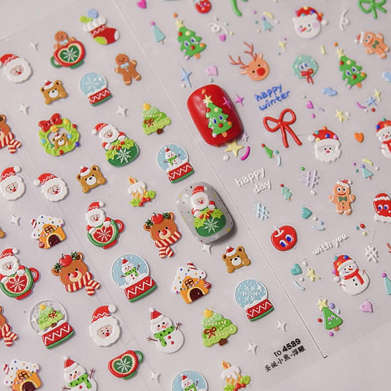 May include: A sheet of Christmas-themed nail stickers with various designs, including Santa Claus, snowmen, reindeer, gingerbread men, snow globes, and Christmas trees. The stickers are in red, green, white, and brown colors. The sheet also includes the text "happy winter", "happy day", and "with you".