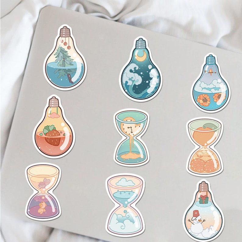 May include: Nine colorful stickers featuring various designs, including a lightbulb with a Christmas tree inside, a lightbulb with a snowman inside, a lightbulb with a strawberry inside, a lightbulb with a cloud inside, an hourglass with sand, an hourglass with water, an hourglass with fruit, and an hourglass with a clock inside.
