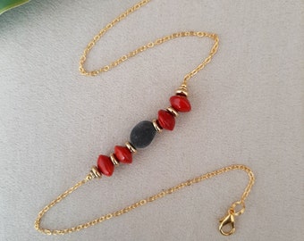 Zanzibar seed necklace and church seed. Gold plated chain.