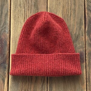 hand-knitted hats in gold red color from 100% merino lambswool