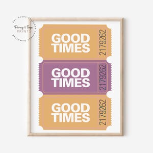 May include: Three ticket-shaped printable wall art prints with the text "GOOD TIMES" in white on a yellow, purple, and yellow background. The ticket numbers are 2179262.
