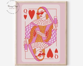 May include: A pink and red illustration of the Queen of Hearts playing card. The Queen is wearing sunglasses and holding a glass of wine. The card is surrounded by a pink border.