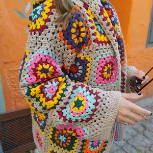 This granny crochet multi squares jacket is a perfect gift choice for your loved one and will bring unique look to her style.