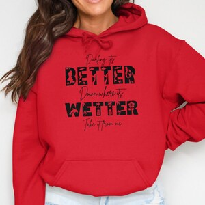 Red hoodie with "Darling it's better Down where it's wetter" text.