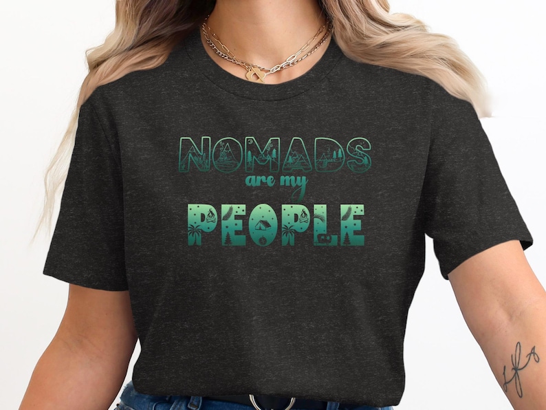 Dark grey t-shirt with "NOMADS are my PEOPLE" in green ombre text.