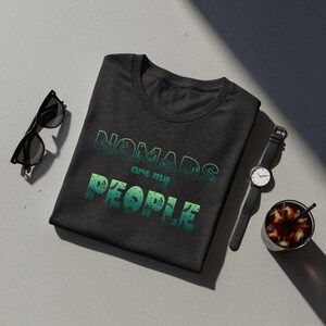 Dark t-shirt with "Nomads are my people" text and nature graphics.