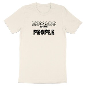 Cream t-shirt with "NOMADS are my PEOPLE" text and illustrations.