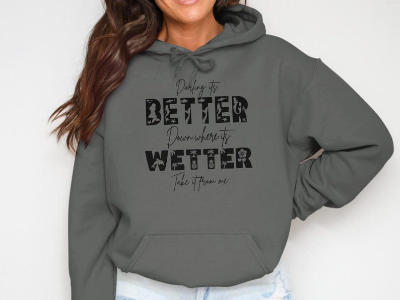 Dark gray hoodie with text "Darling it's better wetter, take it from me".