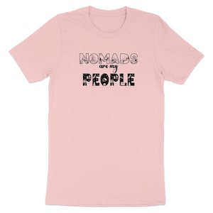 Pink t-shirt with "NOMADS are my PEOPLE" text in playful fonts and icons.