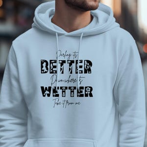 White hoodie with "Darling it's Better Down Where It's Take It From Me" text.