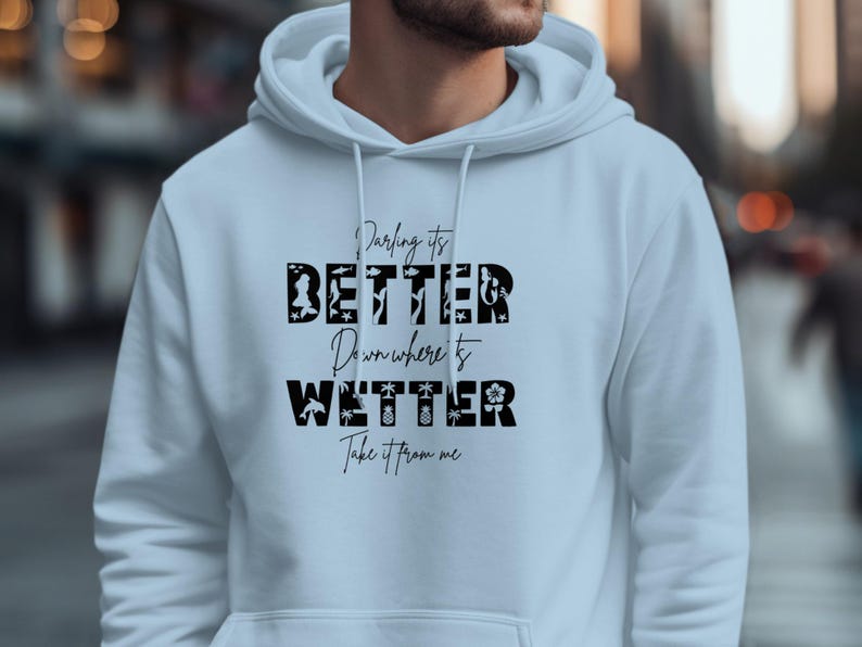 White hoodie with "Darling it's Better Down Where It's Take It From Me" text.