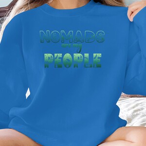 Blue sweatshirt with green text "NOMADS are my PEOPLE".