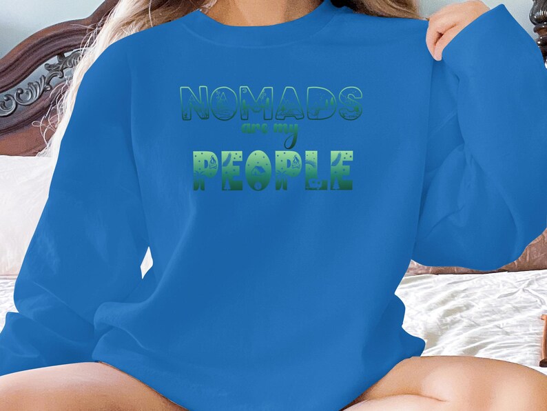 Blue sweatshirt with green text "NOMADS are my PEOPLE".